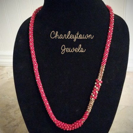 Asymmetrical red and gold kumihimo necklace