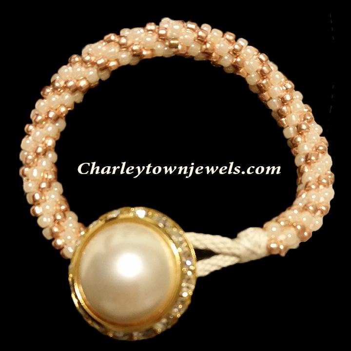 Button closure white and gold bracelet