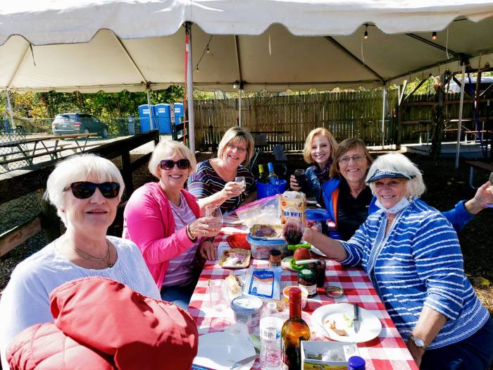 Women sitting around a picnic bench
