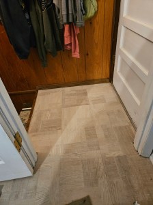 New tile on landing at basement stairs